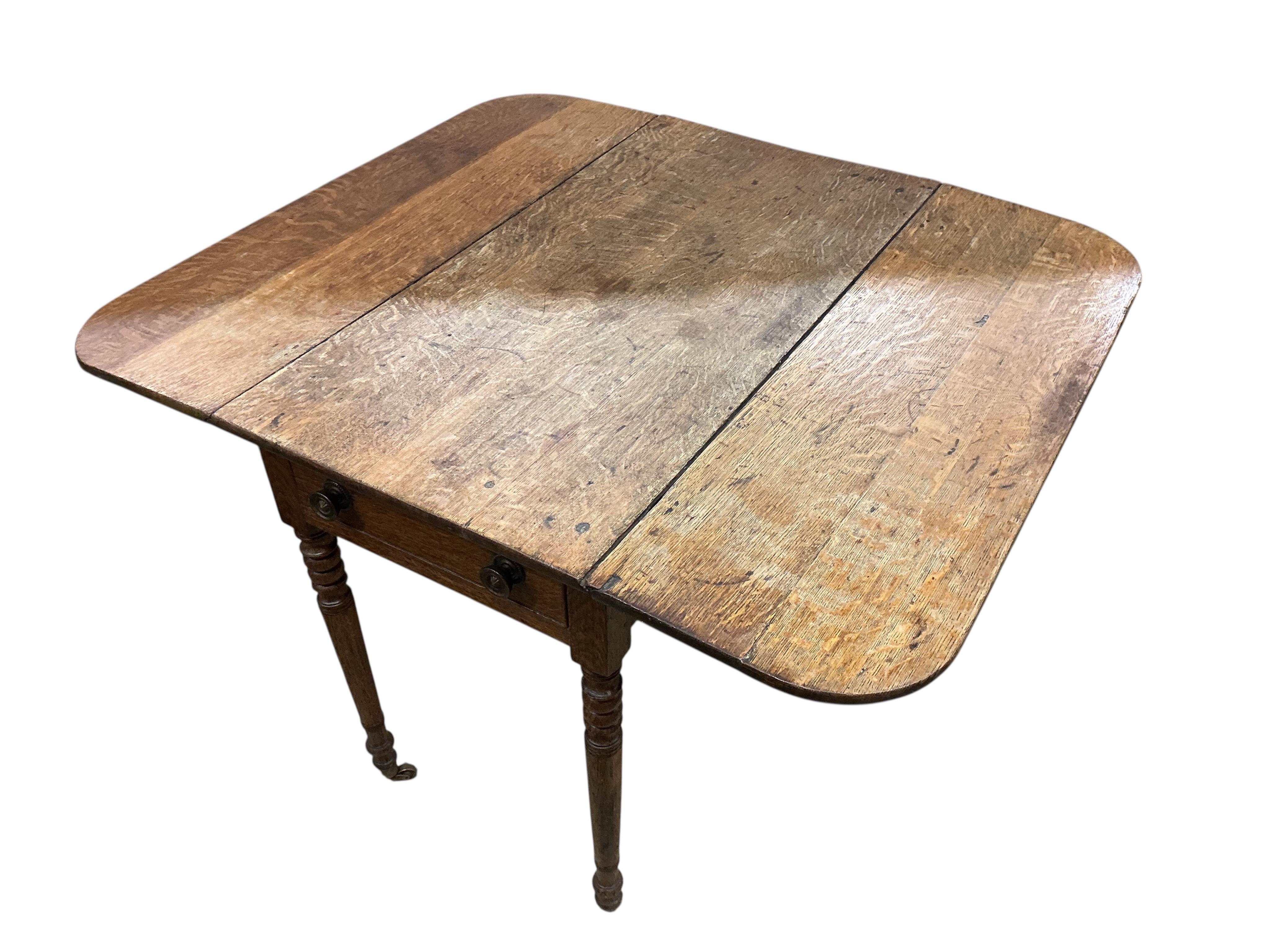 An early 19th century oak drop flap table, in need of restoration, width 91cm, depth 48cm, height 70cm